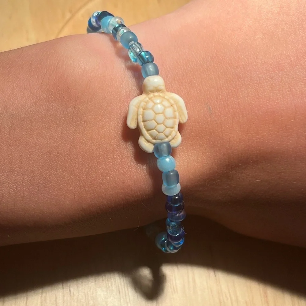 Handmade pack of matching blue beaded bracelets beach theme gold turtle starfish